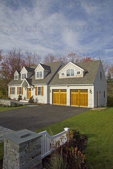 Driveway leading towards garage of single family home