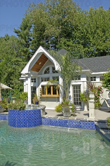 Swimming pool in front of pool house