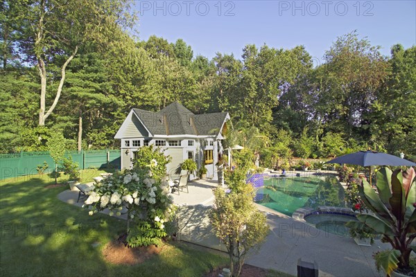 Swimming pool in front of pool house