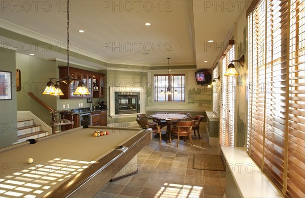Traditional game room with pool and poker table