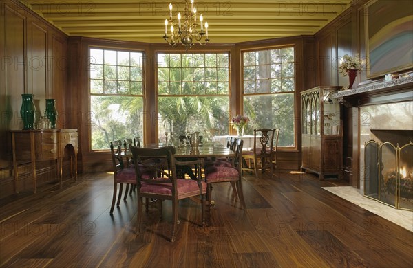 Elegant dining room with bay windows and fireplace