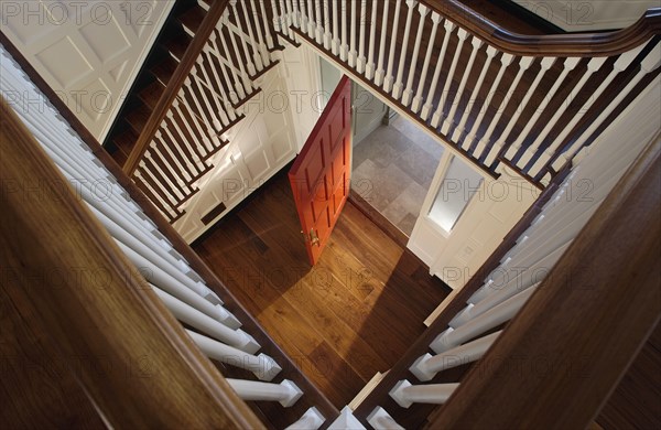 Look through staircase to open red door