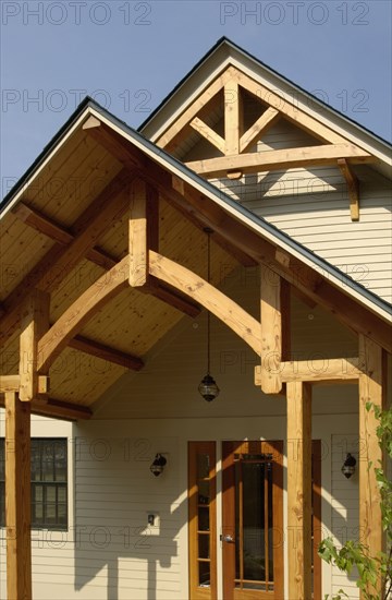 Home front entrance with wooden overhang