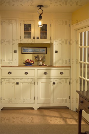 Kitchen pantry area with cabinets