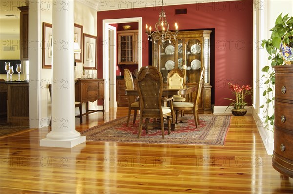 Traditional Dining room with high back chairs and heart pine hardwood floors