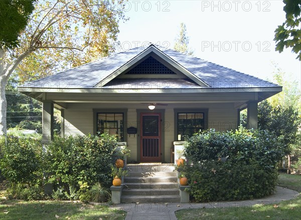 Front exterior green bungalow