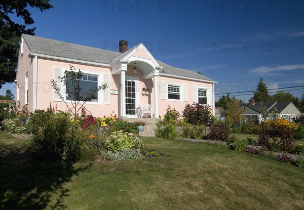 Exterior view of a one story peach colored house at Bellingham