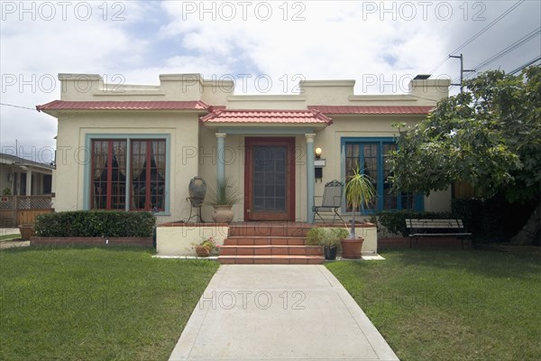 Exterior one story Italianate cottage at San Diego