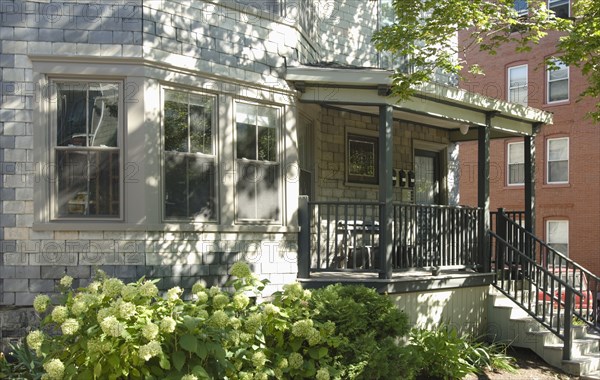 Front porch on gray brick home