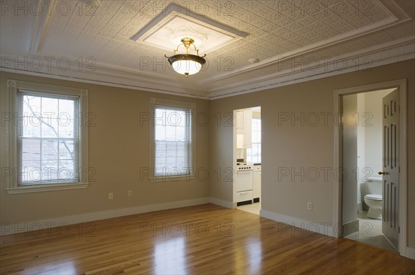 Empty room in apartment with hardwood floor