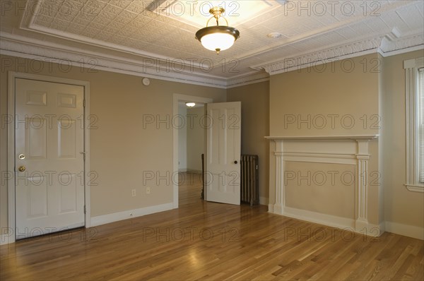 Room in empty apartment with hardwood floor