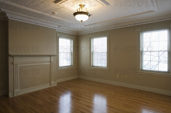 Empty room in apartment with hardwood floor