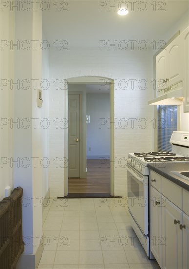 Tile floor in small apartment kitchen