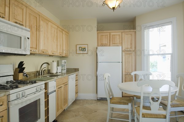 Traditional kitchen with light colored cabinets