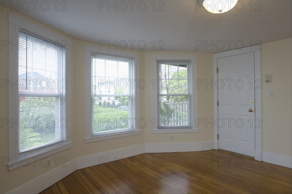 Empty room in apartment with hardwood floor