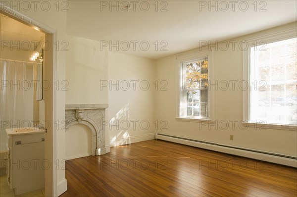 Empty room in apartment with hardwood floor