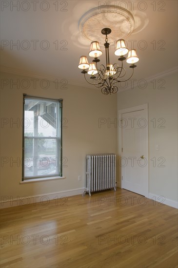 Empty room in apartment with hardwood floor