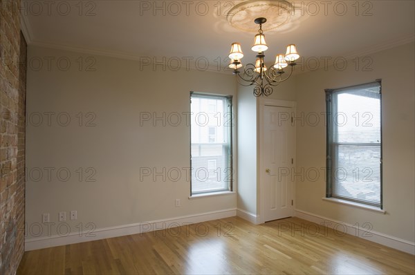 Empty room in apartment with hardwood floor