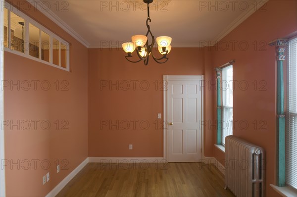 Empty room in apartment with hardwood floor