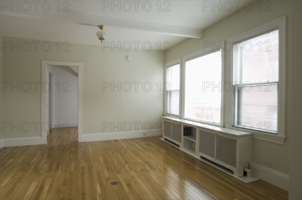 Empty room in apartment with hardwood floor