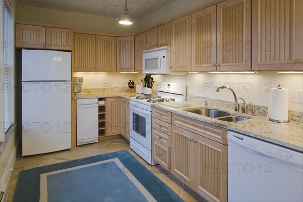 Traditional kitchen with light colored cabinets