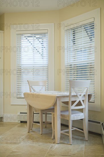 Small kitchen table by windows