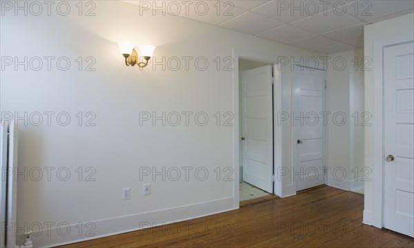 Empty room in apartment with hardwood floor