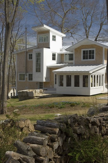 Contemporary multiple story shingle style house