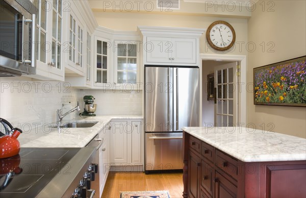 Traditional kitchen with marble countertops