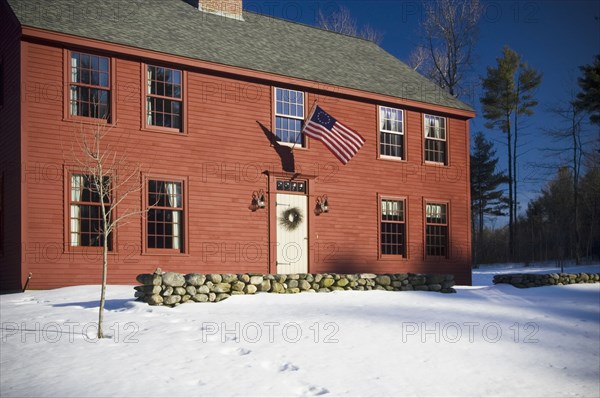 Front exterior red saltbox style home