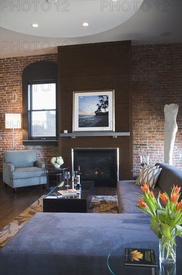 Contemporary living room with brick wall