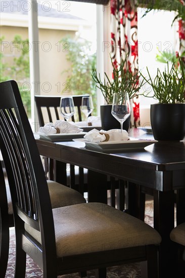 Place settings on traditional dining table