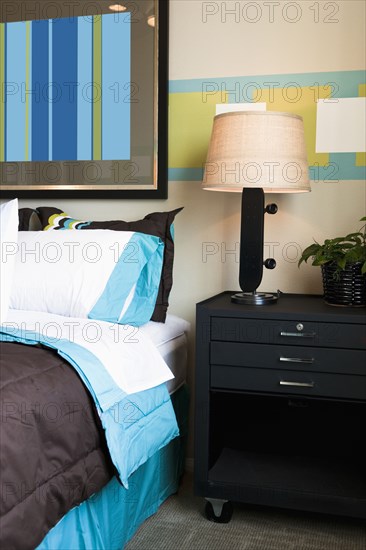 Skateboard lamp on nightstand in boy's room