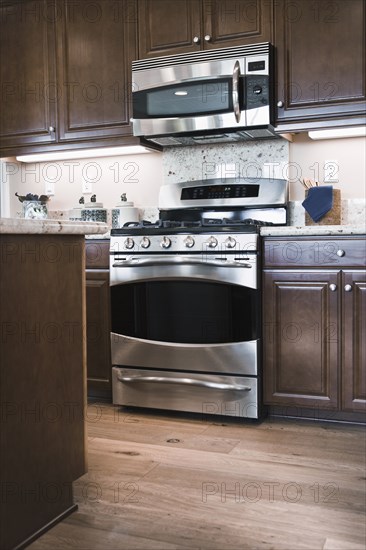 Hardwood floors and cabinets in contemporary kitchen