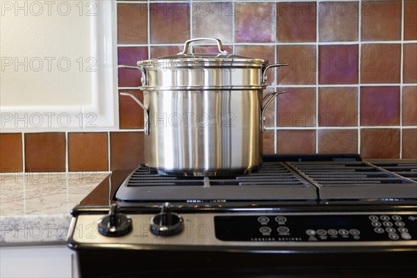 Close-up of utensil on stove in kitchen at home