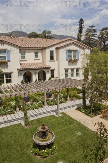 Exterior shot of a residential structure with garden and walkway in foreground