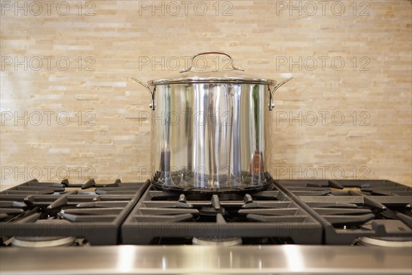 Close-up of a utensil on stove in kitchen at home