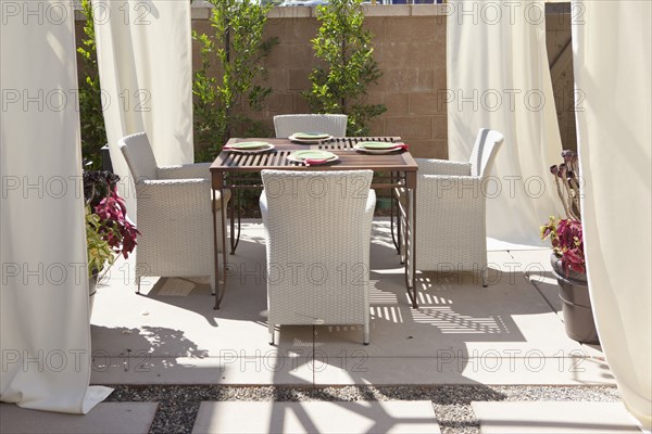 Dining area with curtains in the garden