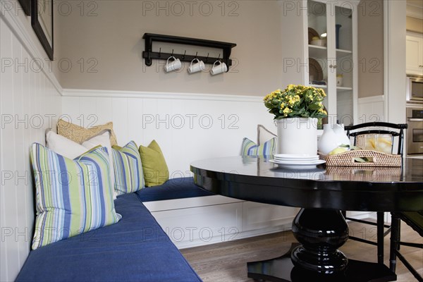 Cushioned seat at dining table in a house