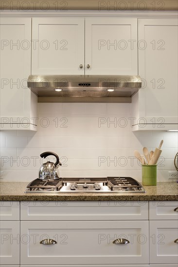 Close-up of a kettle on stove in the kitchen at home