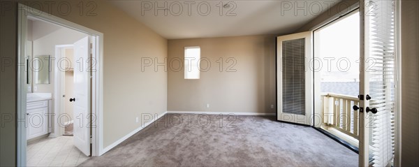 Empty room with outdoor view through balcony at Ontario