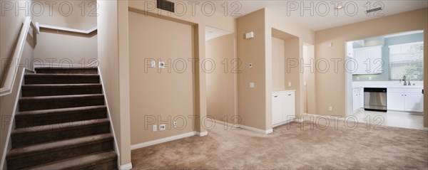 Empty house with stairs and kitchen at Ontario