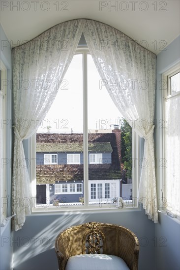 View of curtain on glass window at home