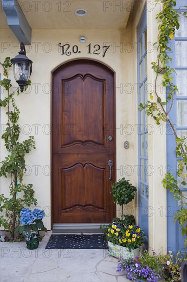 House with closed brown door at Balboa Island