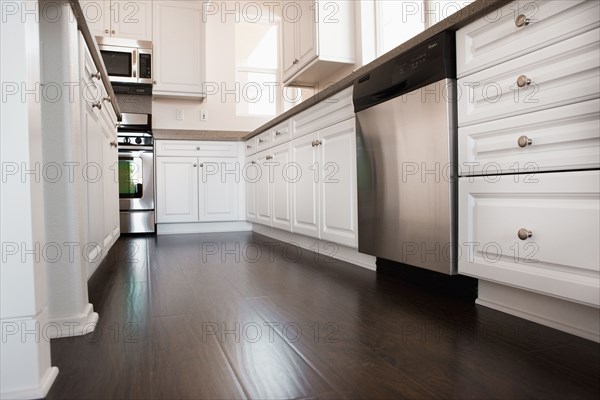 View of a kitchen having white cabinets at home