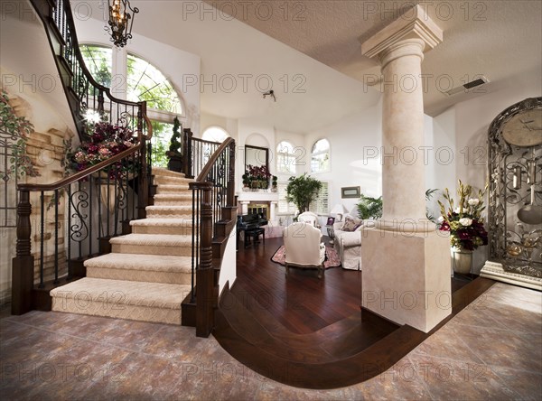 Carpet on stairs with living room in background at home