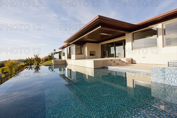 Swimming pool with luxury house against the sky at Laguna Niguel