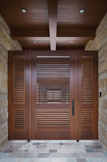 Foyer with closed wooden door