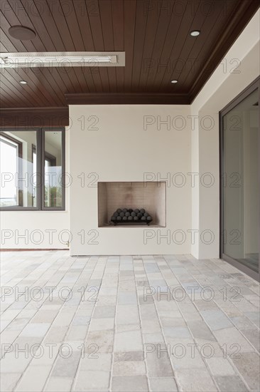 Covered patio with fireplace at Newport Beach