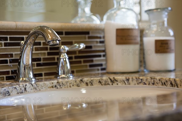 Detail shot of washbasin with toiletries in the bathroom at home